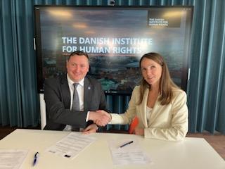 visit Ceslav Panico, People’s Advocate (Ombudsman) of Moldova, and Mette Thygesen, International Director at the Danish Institute for Human Rights shaking hands after signing MOU
